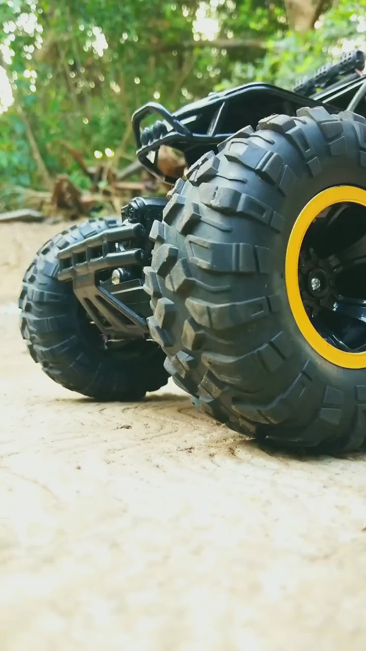 Load video: Premium Quality 4x4 RC Rock Monster Truck Remote Control Car for Kids | 1:18 Scale Rock Crawler Offroad High Speed Racing Car Toy for Boys &amp; Girls (Random Color)